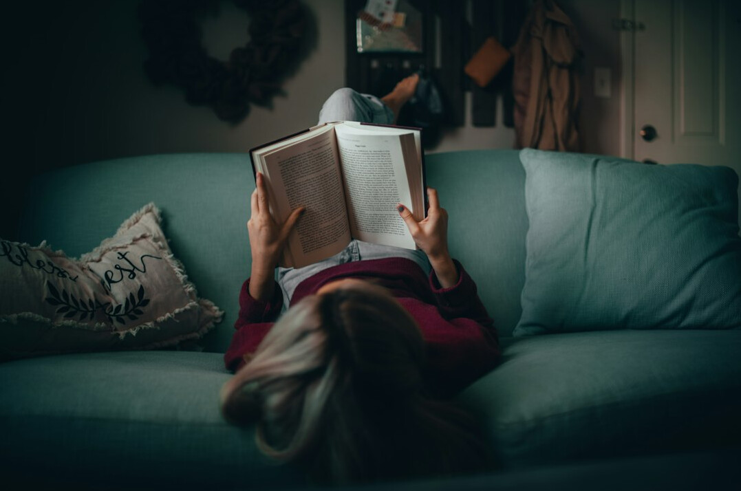 person reading mystery novel