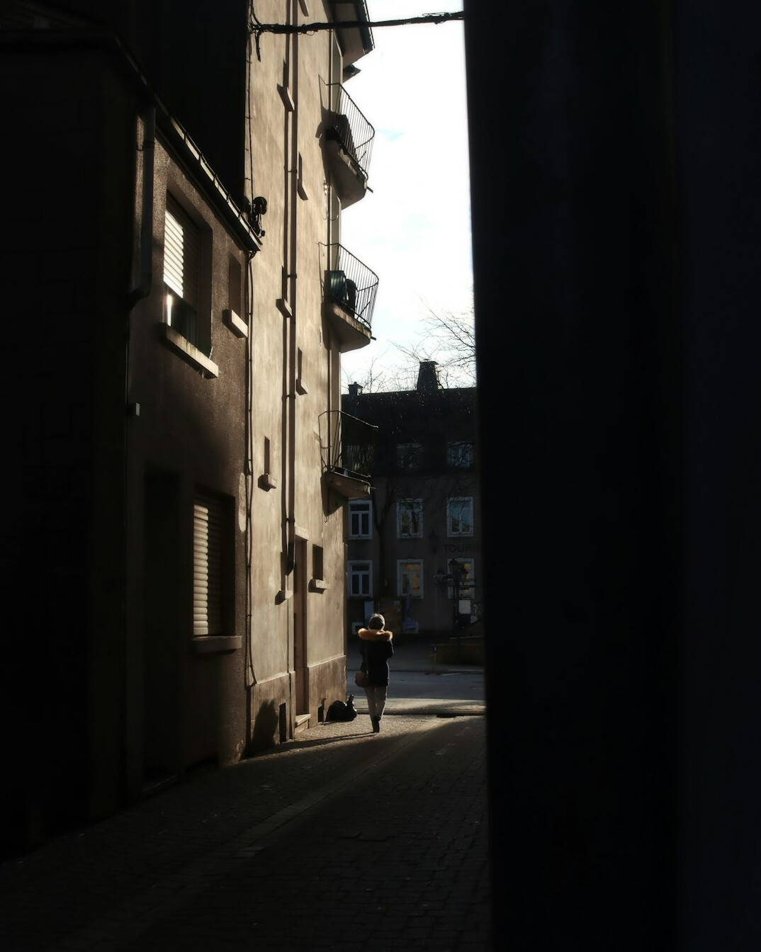 shadowy figure in alley